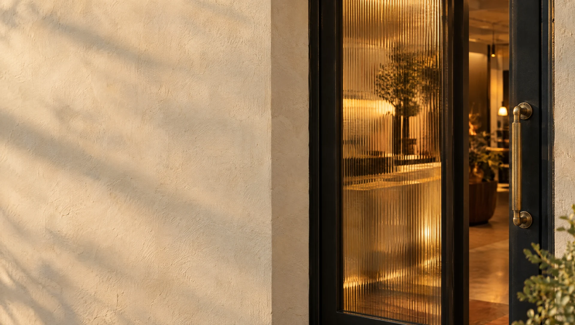 An open glass door welcoming the next chapter of a local business
